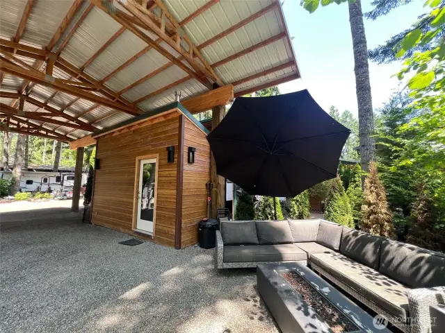 PATIO FURNITURE WITH UMBRELLA AND FIRE TABLE