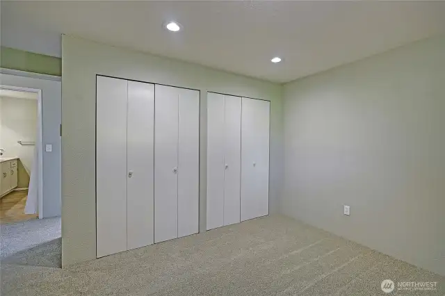 Unit 1 Primary bedroom wall of closets.