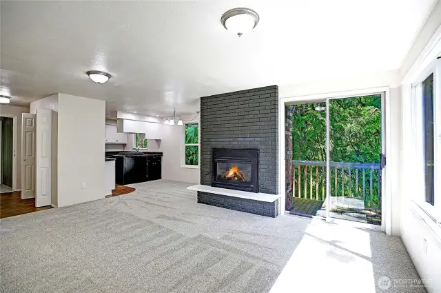 Unit 2 living area with gas fireplace.