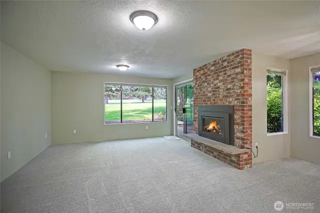 Unit 1 living area with golf course views.