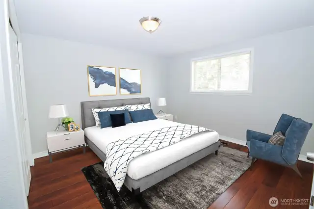 Primary bedroom has plenty of room for a large bed