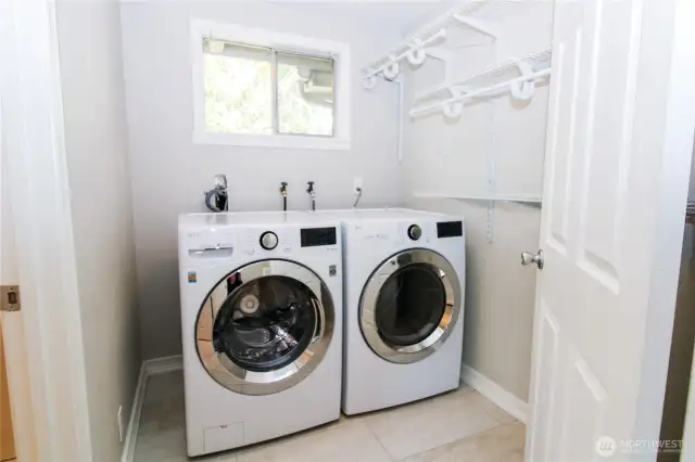 Large laundry room; washer and dryer stay