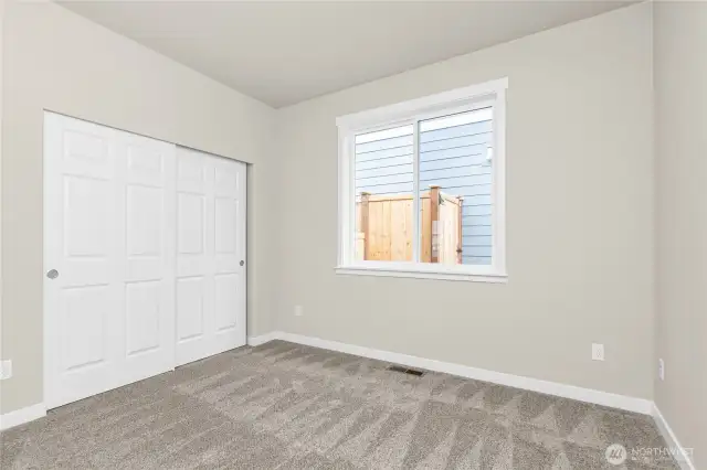 Adjacent to full bathroom is the second bedroom featuring a large reach-in closet.