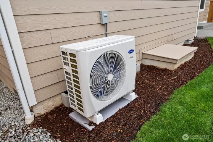 Heat pump providing both heat and cooling for year-round comfort.