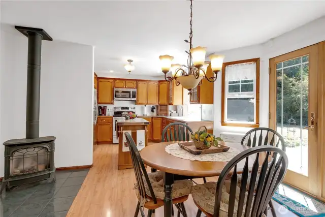 Kitchen with propane free standing stove that heats this home up just nicely!