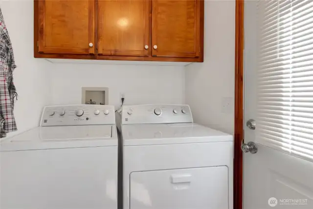Utility and mud room with access to back .yard patio. W/D are only a few years old.