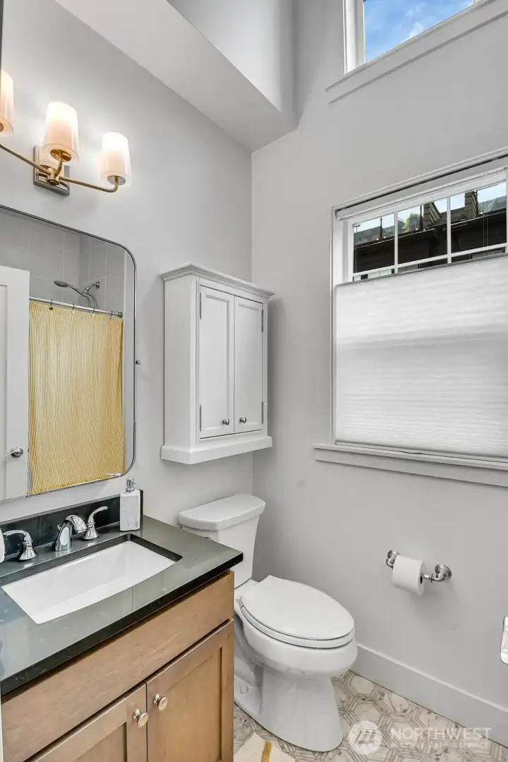 Vaulted ceiling family bathroom.