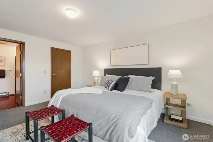 The generous primary suite is a wonderful place to retreat, with a walk-in closet & bathroom.
