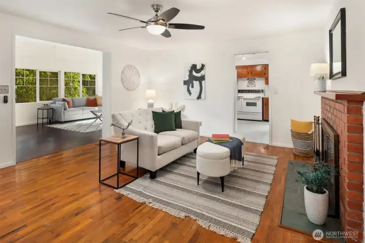 The family room flows into the sunroom, with windows 3 walls of windows out to the trees.