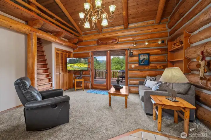 French doors open from the interior to multiple deck spaces, creating seamless indoor-outdoor living throughout the home.