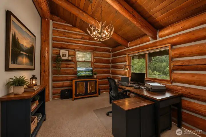 Vaulted ceilings and spectacular views create an inspiring work-from-home setting filled with natural light and peaceful surroundings.