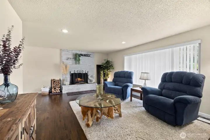 The living room is light and bright & can fit generously sized furniture