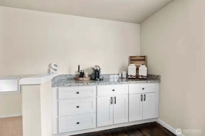 The coffee bar/buffet adds great storage and versatility to the kitchen space