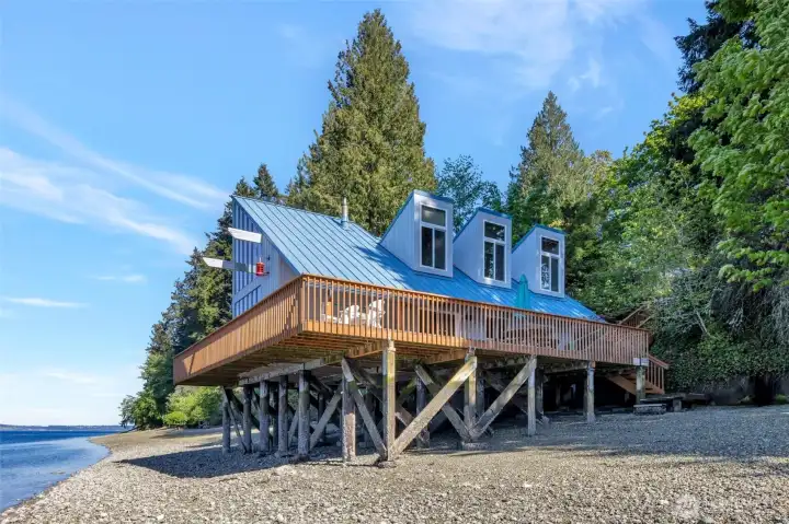 Your beach is protected by a cement bulkhead, you, you can walk down to the beach from either side of your home.  This is the ultimate water front property.