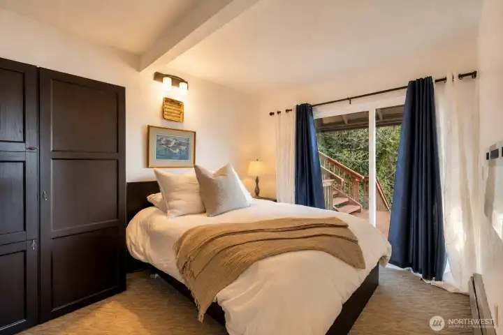 Your bedroom has a sliding door to the deck, open curtains for a sound view, close for privacy. Extra warmth and coziness provided by electric fireplace in your room. Closet in bedroom houses extra storage room as well as the well equipment & water heater.