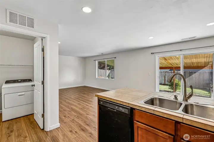 Laundry room connects the kitchen to the garage