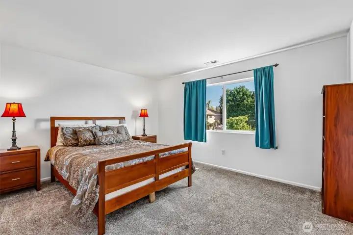 Primary bedroom enjoys peekaboo views