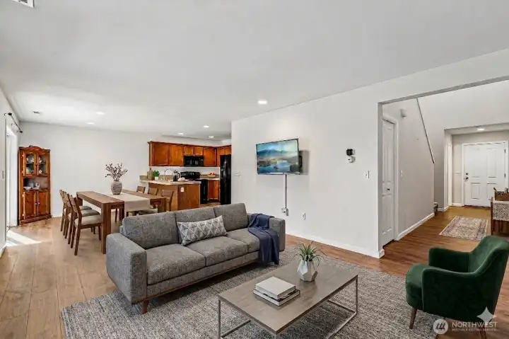 AI generated virtual staging of what the living room and dining room could look like with furniture