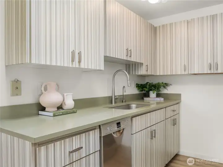 Thoughtful kitchen details include expansive countertops, modern fixtures, abundant cabinetry, and an efficient workspace layout. Thoughtful kitchen details include expansive countertops, modern fixtures, abundant cabinetry, and an efficient workspace layout.