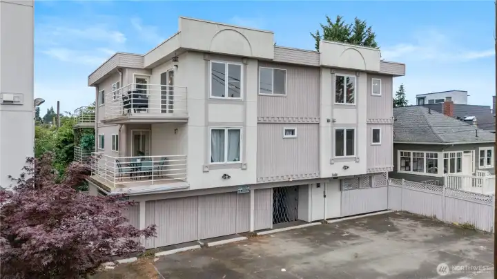The property features secure garage parking with additional paved parking areas, providing convenience and ease of access. The property features secure garage parking with additional paved parking areas, providing convenience and ease of access.