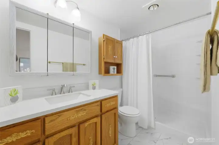 Bathroom with newer walk-in shower