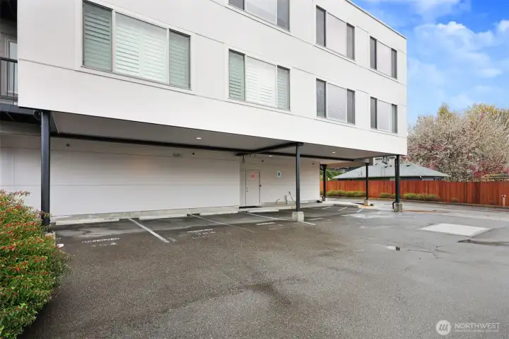 Dedicated, covered off-street parking in this far left space included with the unit.