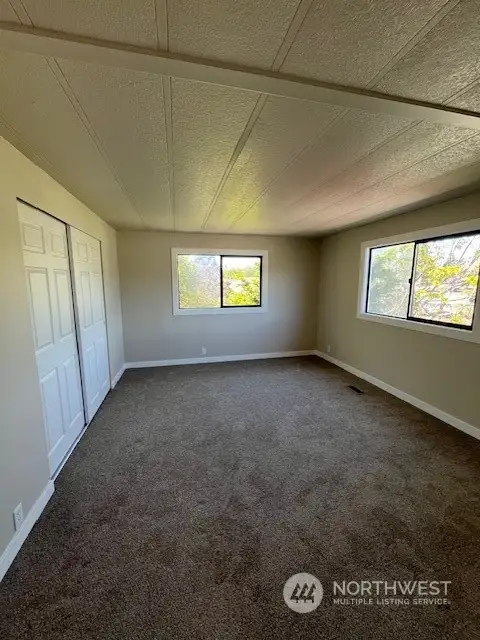 Large Primary Bedroom large closet space, new carpet