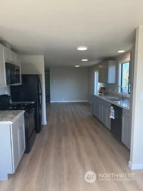 Kitchen has plenty of space with new cabinets, offers large pantry cabinet.