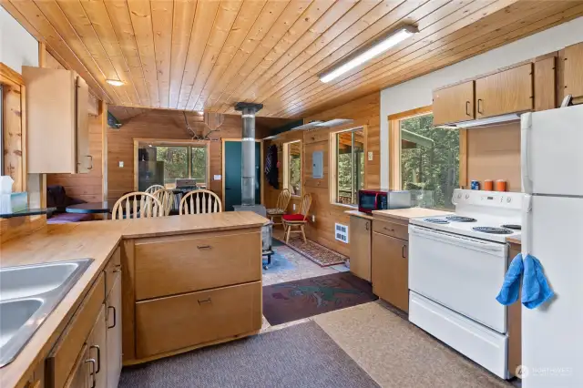 More kitchen! Double sink! Stove/range, fridge, & microwave all stay!