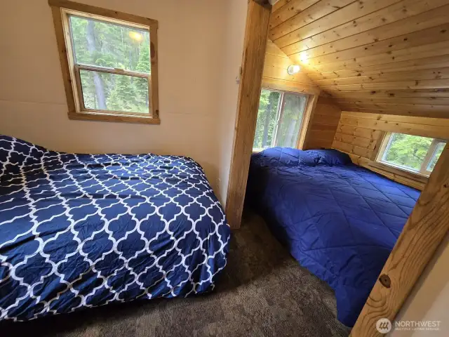 Bedroom 2 has 2 shared sleeping spaces. This could easily be converted to a primary with a large closet!