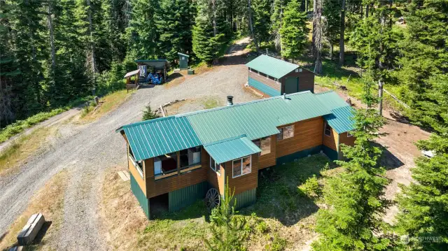 Aerial showing layout of the cabin, shop, & outbuildings.