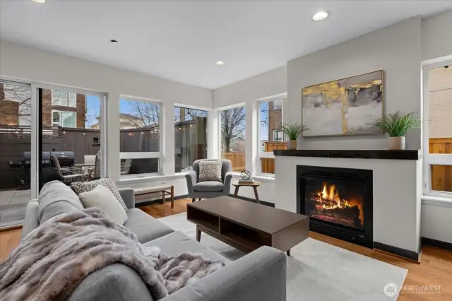 Open living w/ beautiful windows, gas fireplace and easy access to front patio