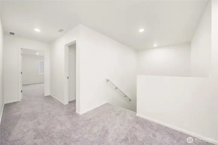 Landing at top of stairs to 2nd floor