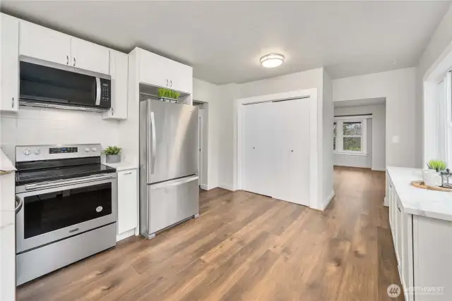 Looking back toward the dining room. The closet conveniently holds the washer and dryer.