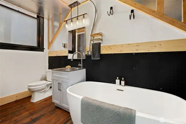 Updated bathroom with free standing large tub and updated throughout with hardwood floors