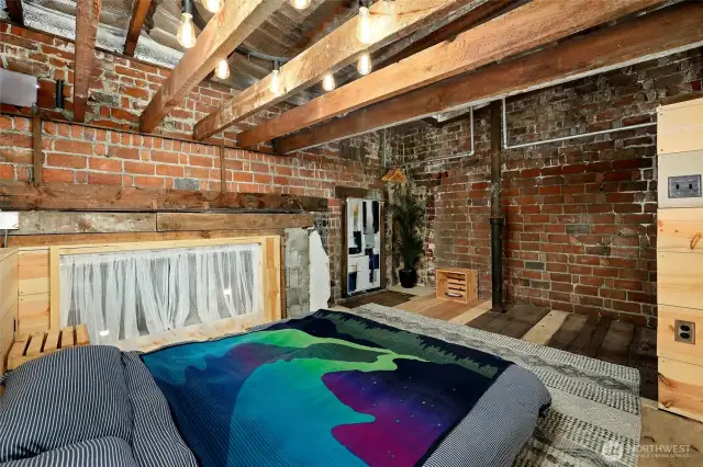 Unique primary bedroom upstairs in back part of building