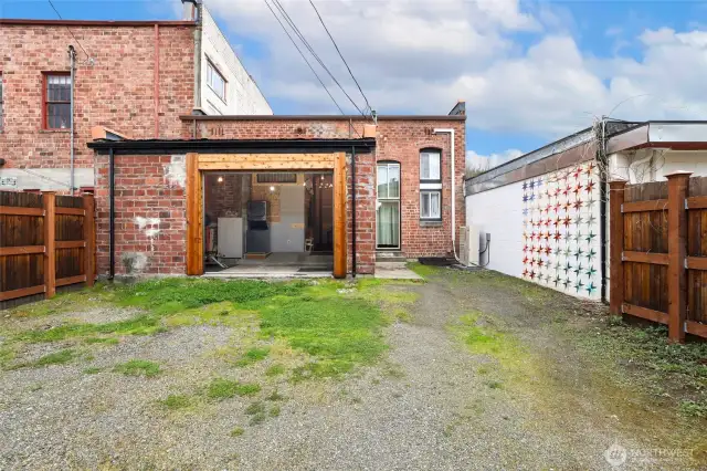 Entrance into garage or weight room or up to buyer