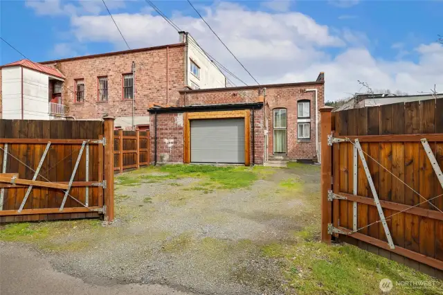 Newly fenced private back side driveway.