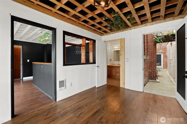 Front room with bathroom, liminal space entry, business room.