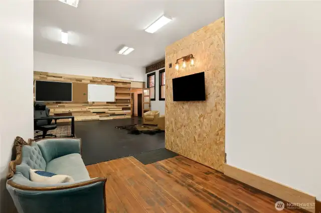 Entry way into front room. Hardwood floors, cement floors, design throughout