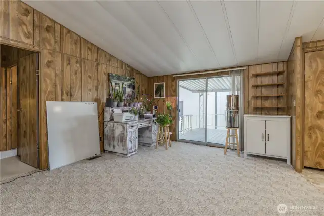 Flex space off the kitchen with slider access to the back deck