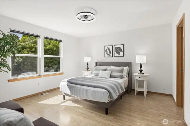 Primary suite looks out to the private backyard.