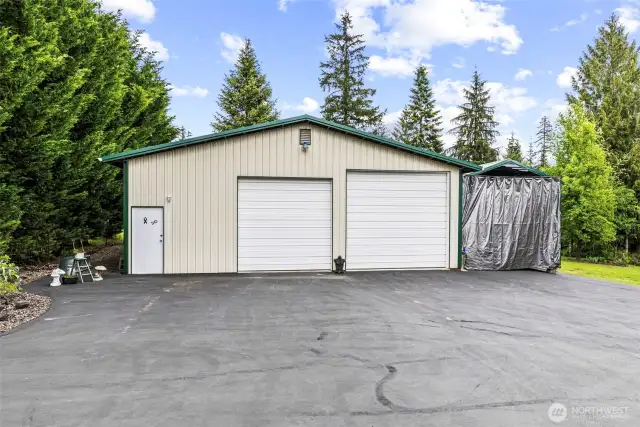 36x36 shop w/XX door & XX door features full RV hookups w/30-amp power plus added 14x 33'6" RV/Carport with second full RV hookup & 30-amp power.