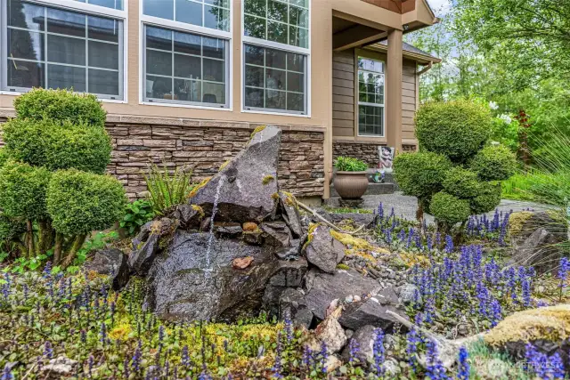 Enjoy the pond with water feature and easy-care landscape as it trickles outside the office window...