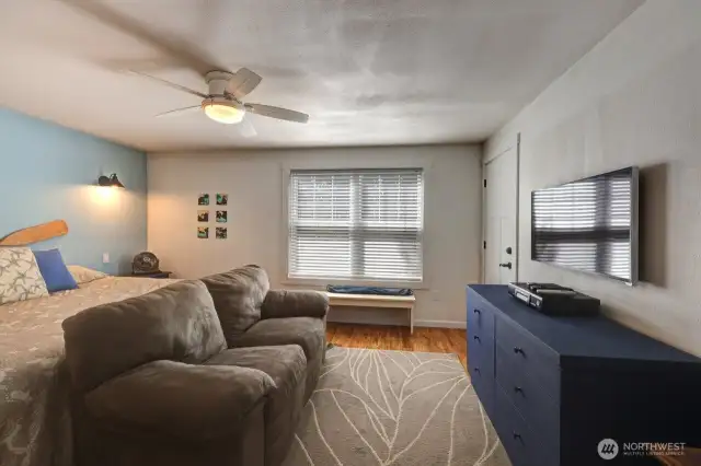 Primary bedroom with walk in closet and sitting area