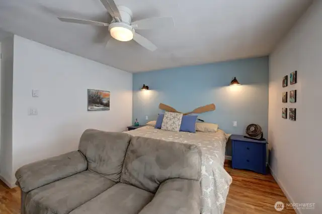 Primary bedroom with walk in closet and sitting area
