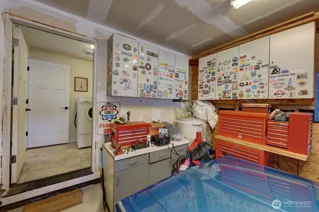 Garage with access to the laundry room and 1/2 bath.