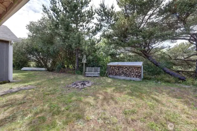 Back yard, wood storage and access to the canal.