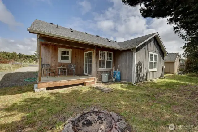 RV parking, fire pit, covered back deck and back yard.