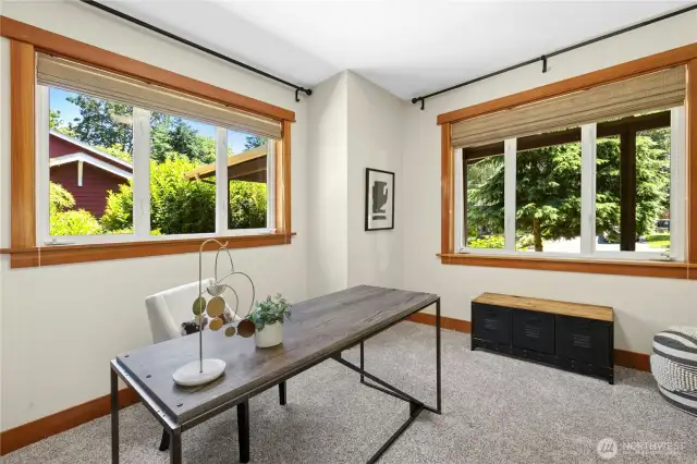 Natural light poors into this front room with builit in book case and French doors.